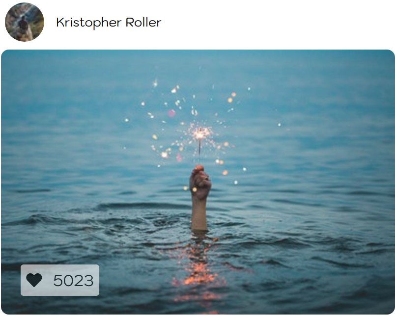 sparkler in hand sticking out of water